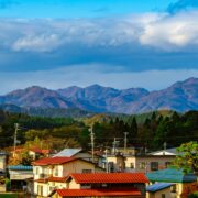 Vertical view of houses and mountains in the background in Daisen city, Akita Prefecture, Japan