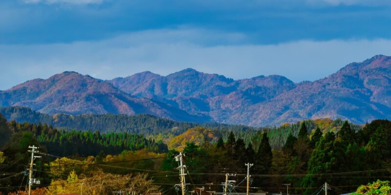 Vertical view of houses and mountains in the background in Daisen city, Akita Prefecture, Japan