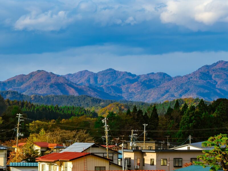 Vertical view of houses and mountains in the background in Daisen city, Akita Prefecture, Japan